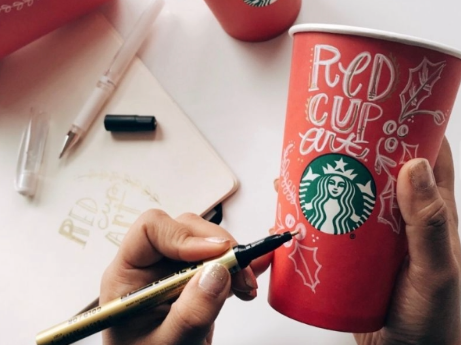 starbucks cup being drawn on